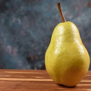 A large yellow pear with slight pink blush